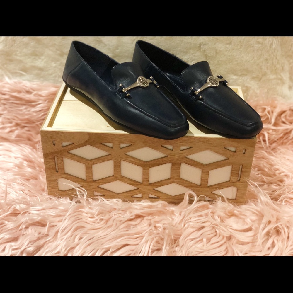 Dkny navy and silver flat shoes .